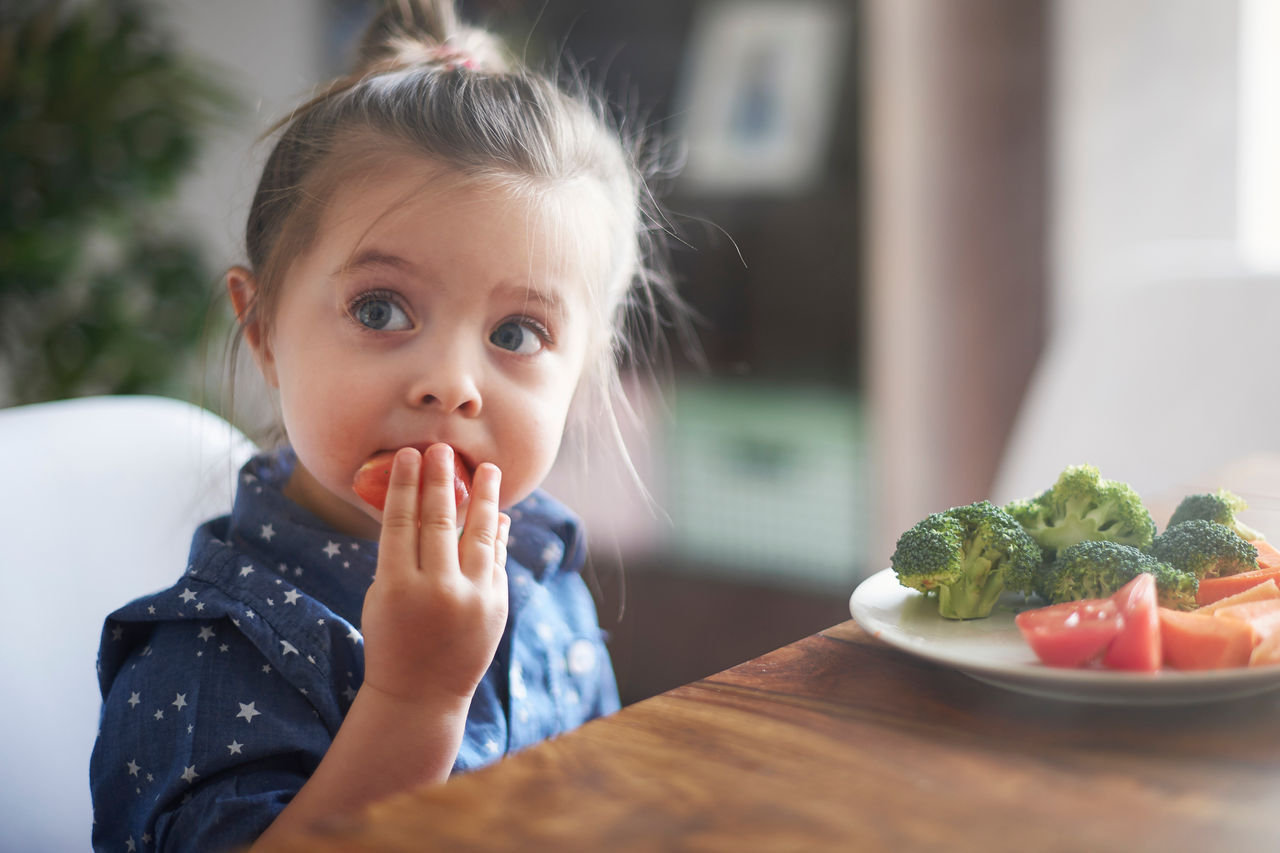 Toddler eating watermelon